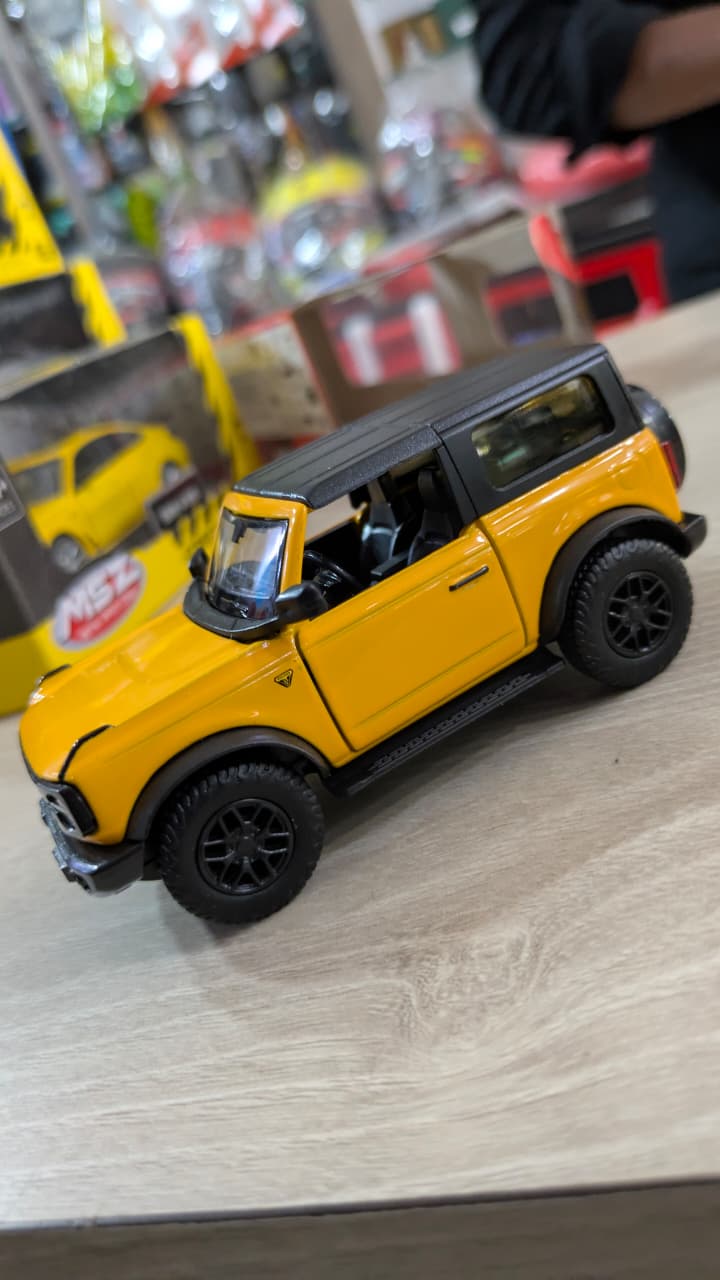1:32 scale Ford Bronco Badlands 2dr yellow RMZ